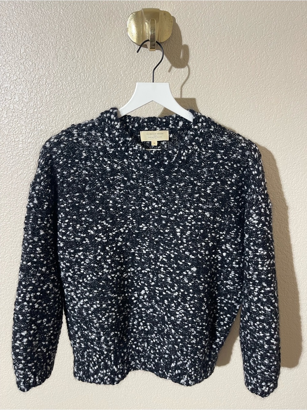 Sézane black and white knit sweater with a speckled texture and a round neckline